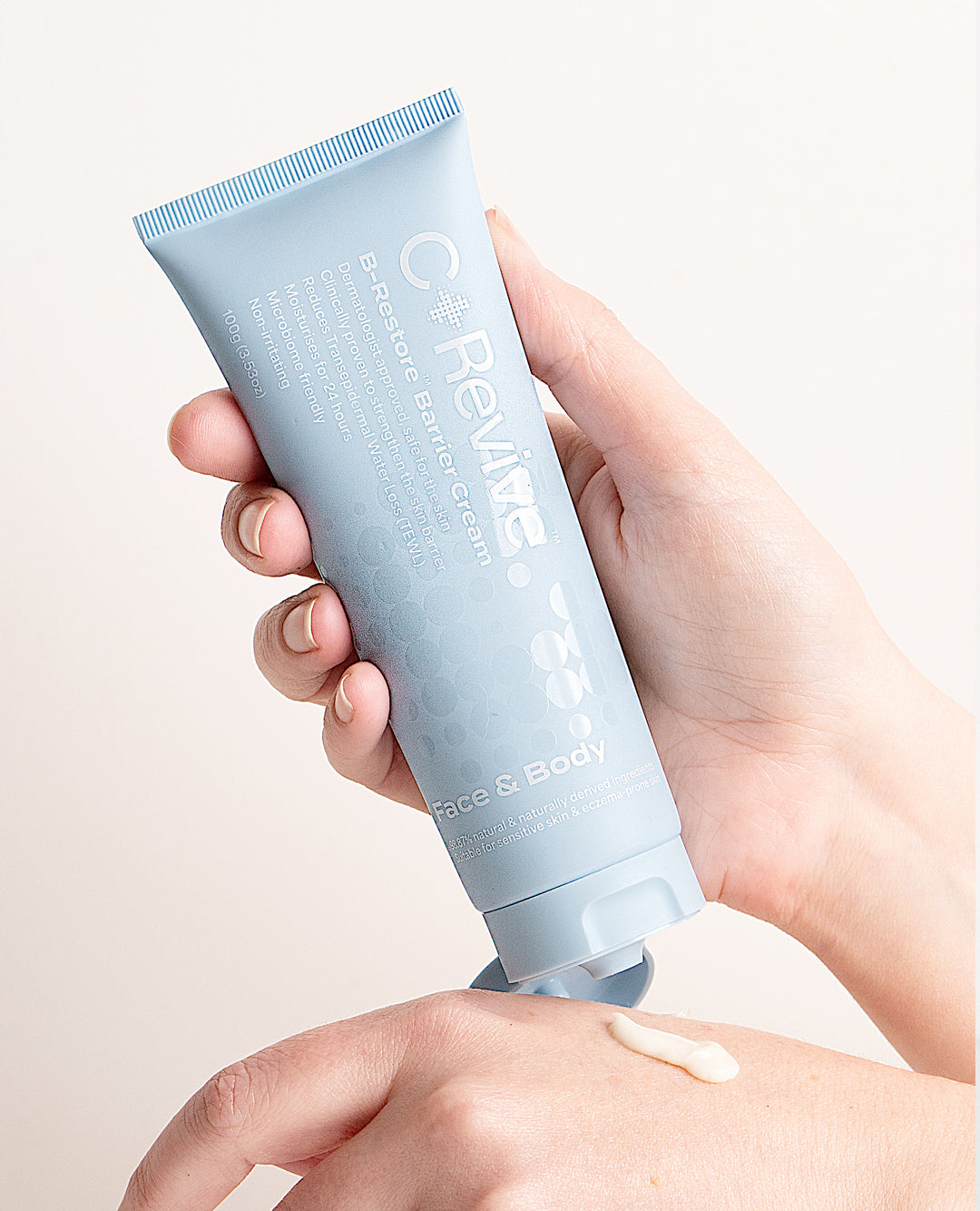 Person applying cream to face